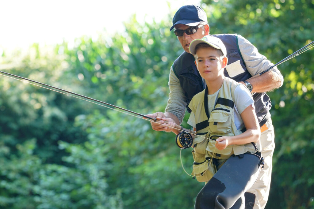 Father,Teaching,Son,How,To,Fly-fish,In,River